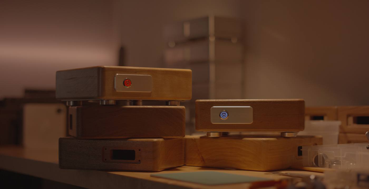 A collection of warm wooden Memories Lockboxes in soft light