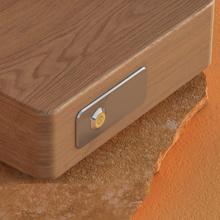 Close-up of the hardwood grain and aluminum control plate of a Memories Lockbox